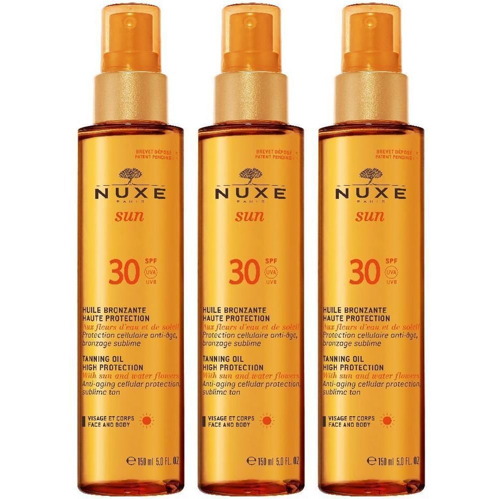 Tre flaconi di Nuxe Sun Olio Solare SPF 30 per viso e corpo.