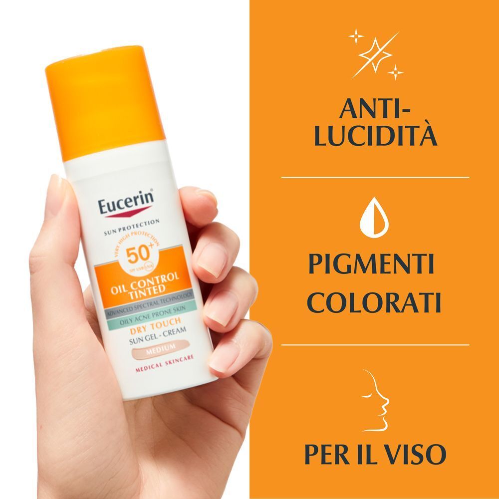 Mano tiene Eucerin Protezione Solare, SPF 50+, colorata. Anti-lucidità, pigmenti, per il viso.