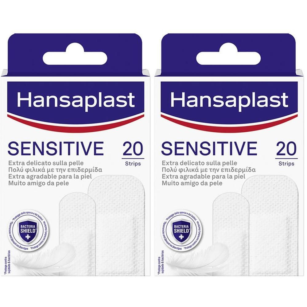 Due confezioni di cerotti Hansaplast Sensitive, 20 pezzi in 2 formati. Con sigillo Bacteria Shield.