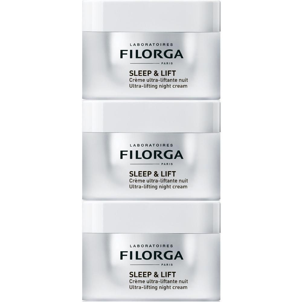 Tre vasetti bianchi di crema notte FILORGA Sleep & Lift.