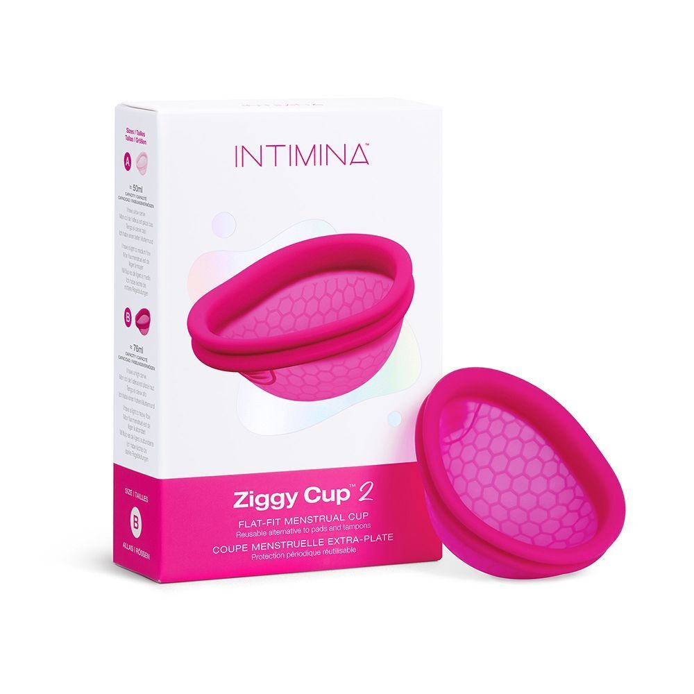 Confezione e una coppetta mestruale rosa con motivo a nido d'ape e bordo doppio.