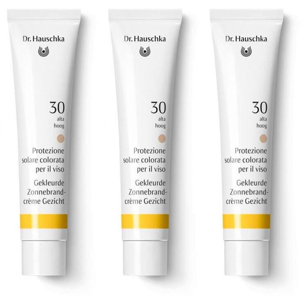 Tre tubetti di crema solare colorata viso Dr. Hauschka SPF 30.