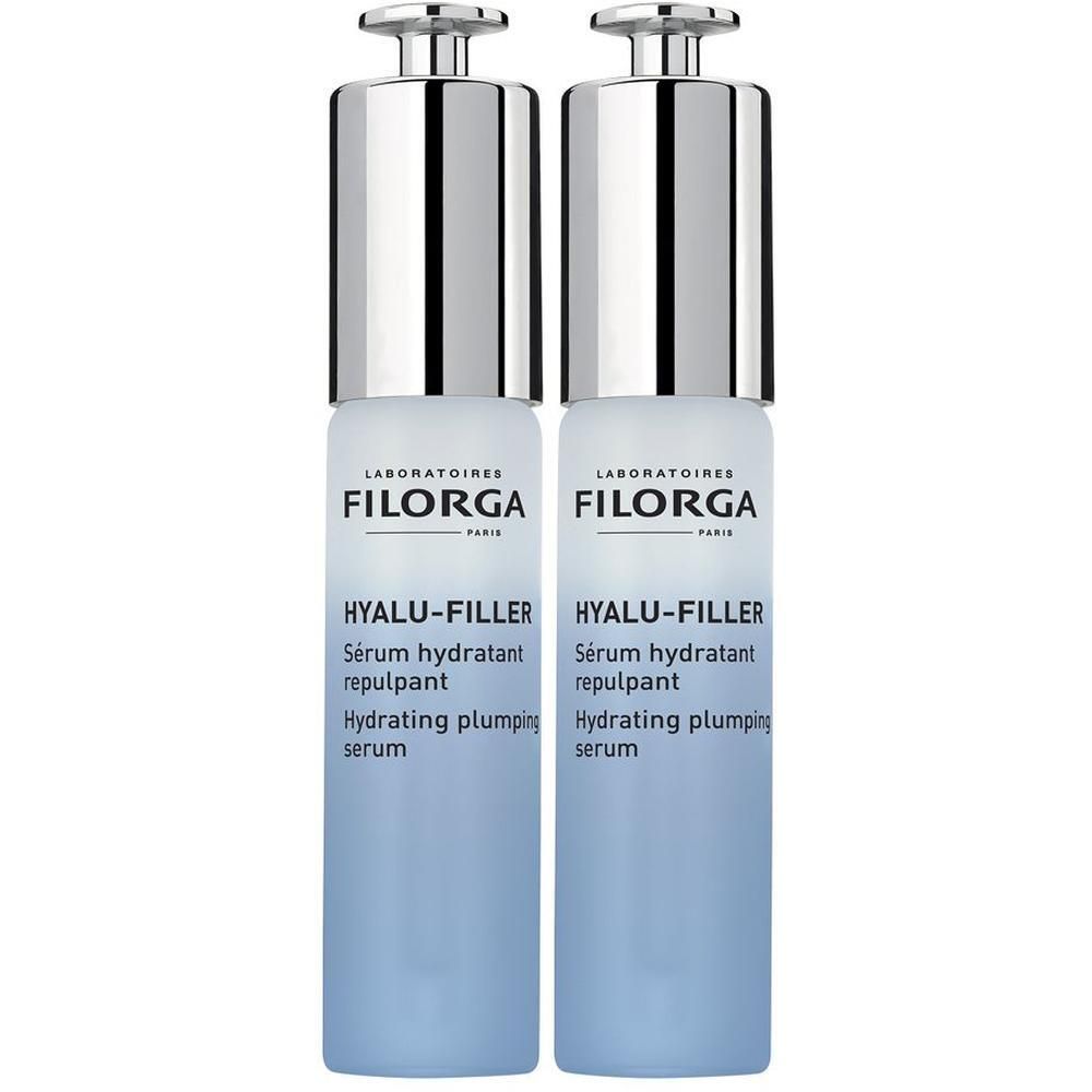 Due flaconi di siero Filorga Hyalu-Filler con tappi a pompa argentati.