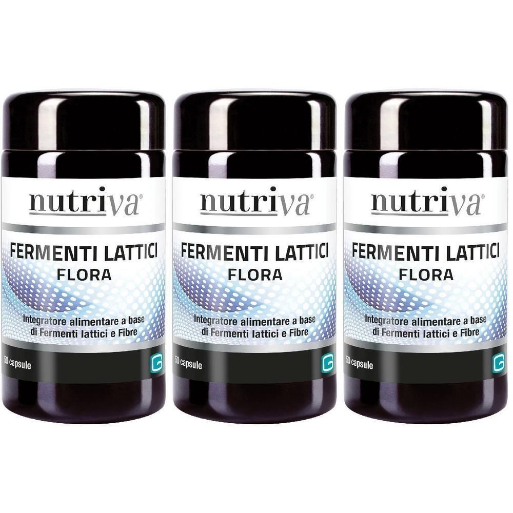 Tre contenitori di capsule Nutriva Fermenti Lattici Flora con tappi neri ed etichette bianche.