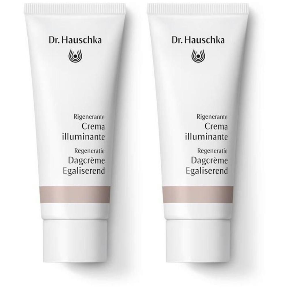 Due tubetti bianchi Dr. Hauschka Rigenerante Crema Illuminante con striscia beige-marrone.