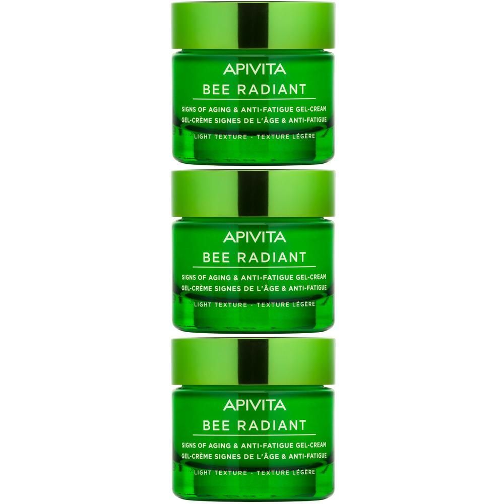 Tre vasi verdi di crema viso APIVITA BEE RADIANT, impilati.