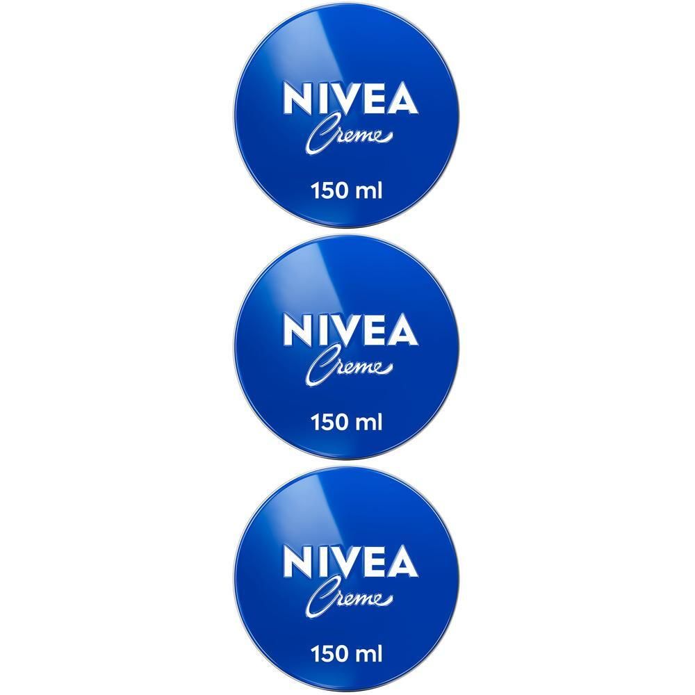 Tre barattoli di Nivea Creme, blu con logo e scritta bianchi.