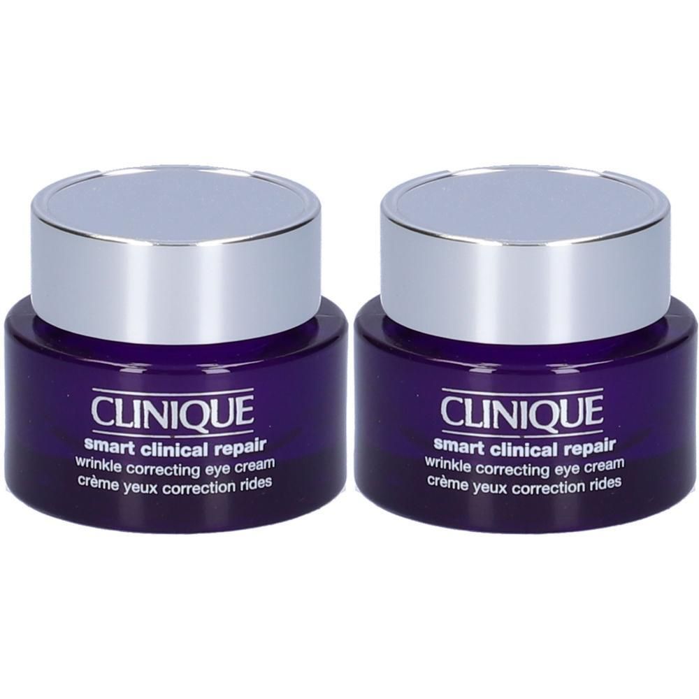 Due vasetti di crema contorno occhi Clinique Smart Clinical Repair con tappi argentati.