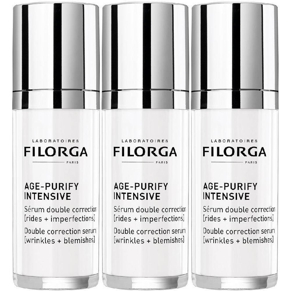 Tre flaconi bianchi con tappi a pompa argentati, Siero FILORGA AGE-PURIFY INTENSIVE.