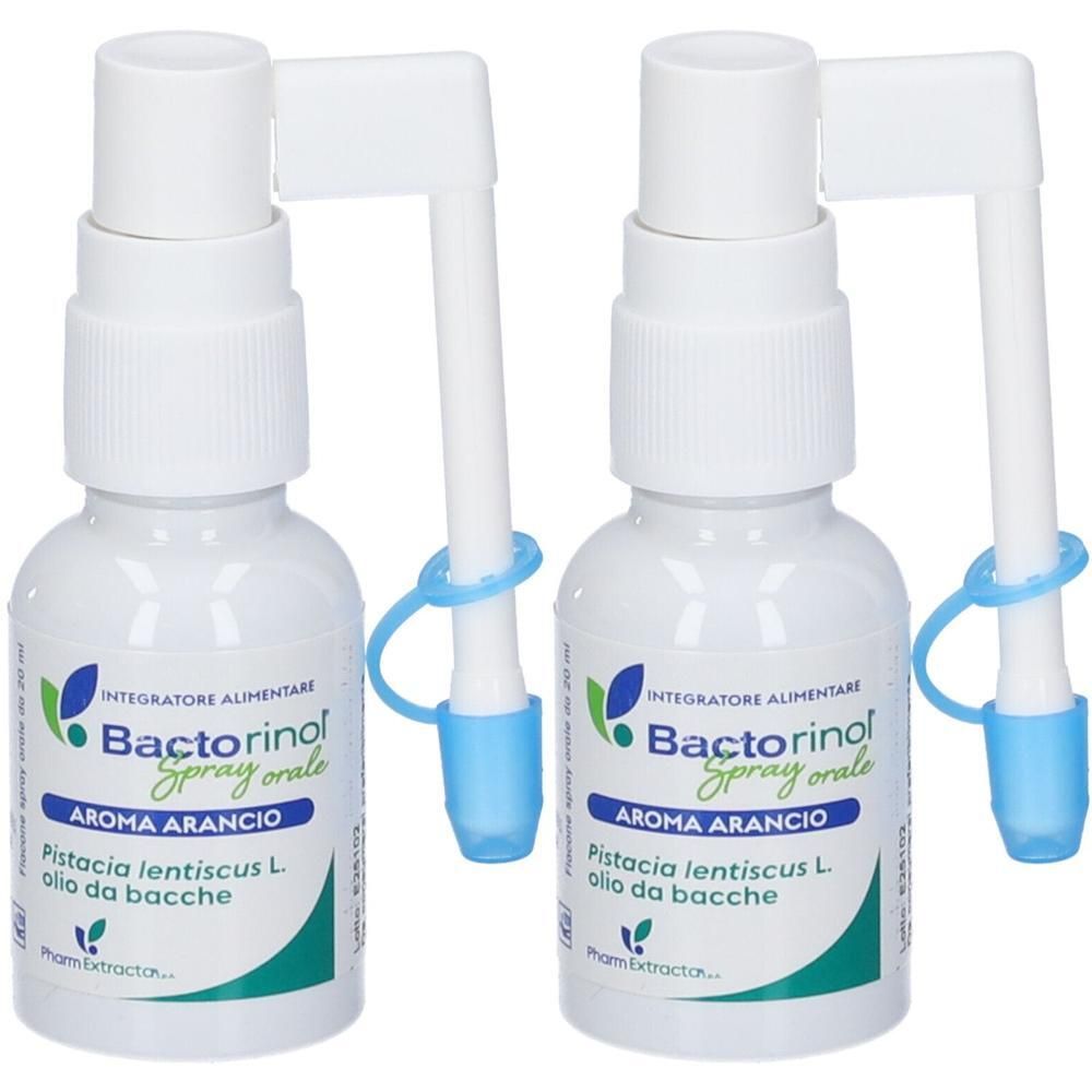 Due flaconi spray bianchi con applicatore e cappuccio protettivo. Etichetta con informazioni sul prodotto.
