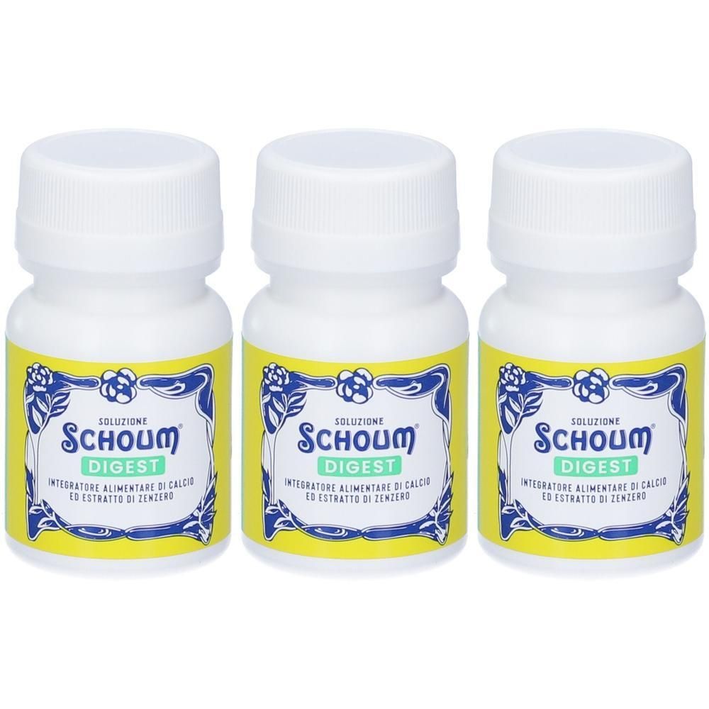 Tre flaconi Schoum Digest con etichetta gialla e tappo bianco.