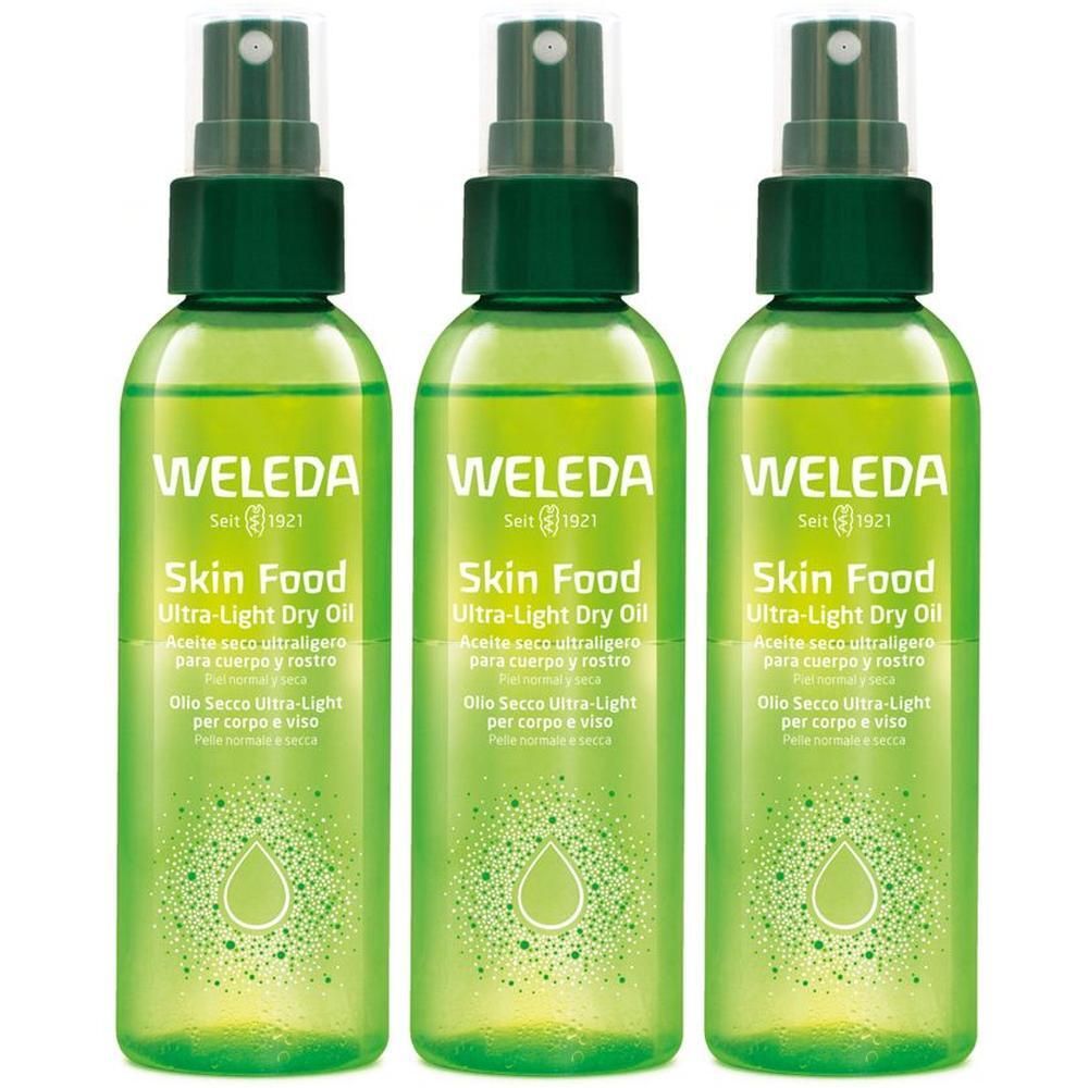 Tre flaconi spray verdi WELEDA Skin Food Olio Secco Ultra-Light con motivo a goccia.