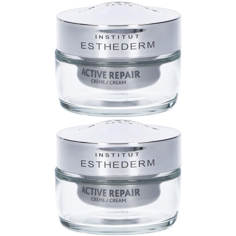 Due vasetti di crema Institut Esthederm Active Repair con tappi argentati.
