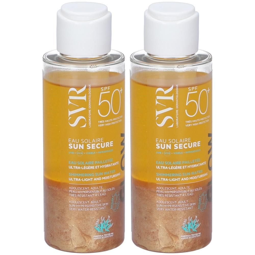 Due flaconi di SVR Sun Secure Glow SPF50+ con liquido dorato e fondo scintillante.
