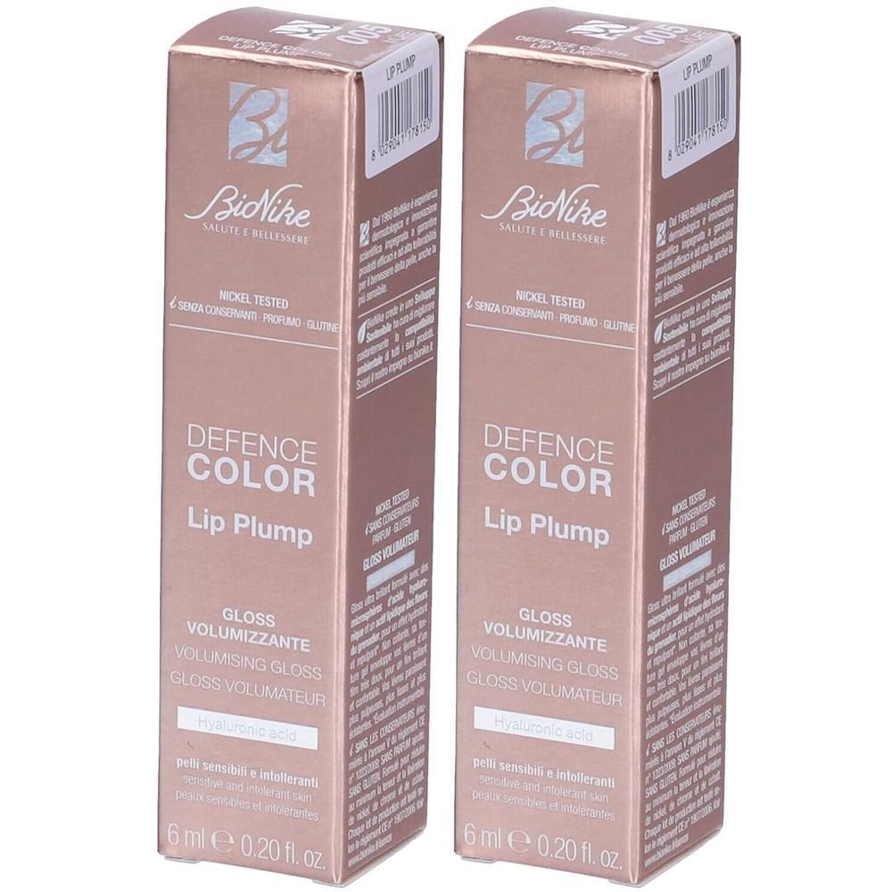 Due confezioni di BioNike Defence Color Lip Plump Gloss, 6ml. Confezione oro rosa con informazioni sul prodotto.