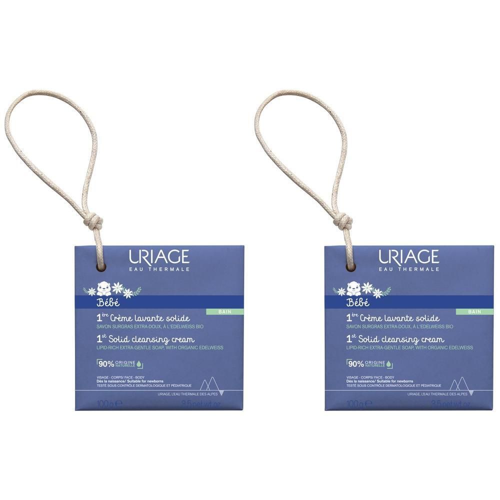 Due confezioni di crema detergente solida Uriage Bébé 1a con cordini.