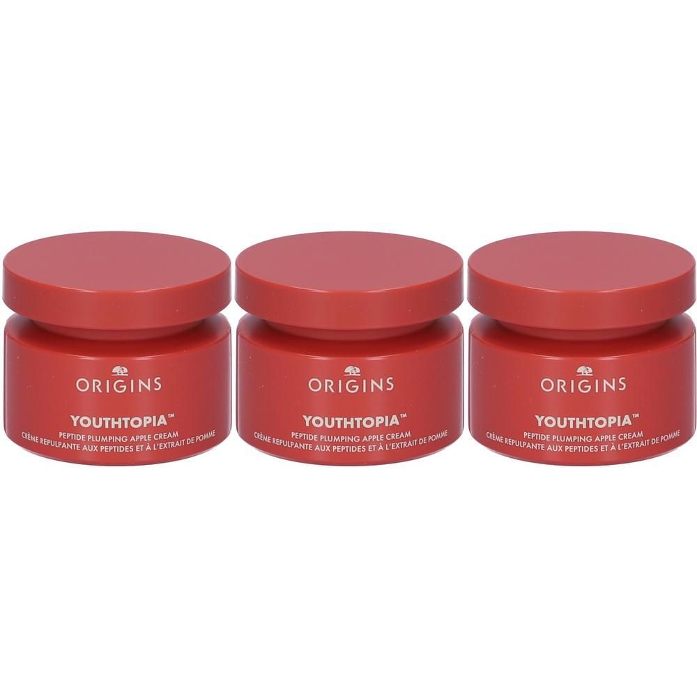 Tre vasetti Origins Youthtopia Peptide Plumping Apple Cream con tappi rossi.