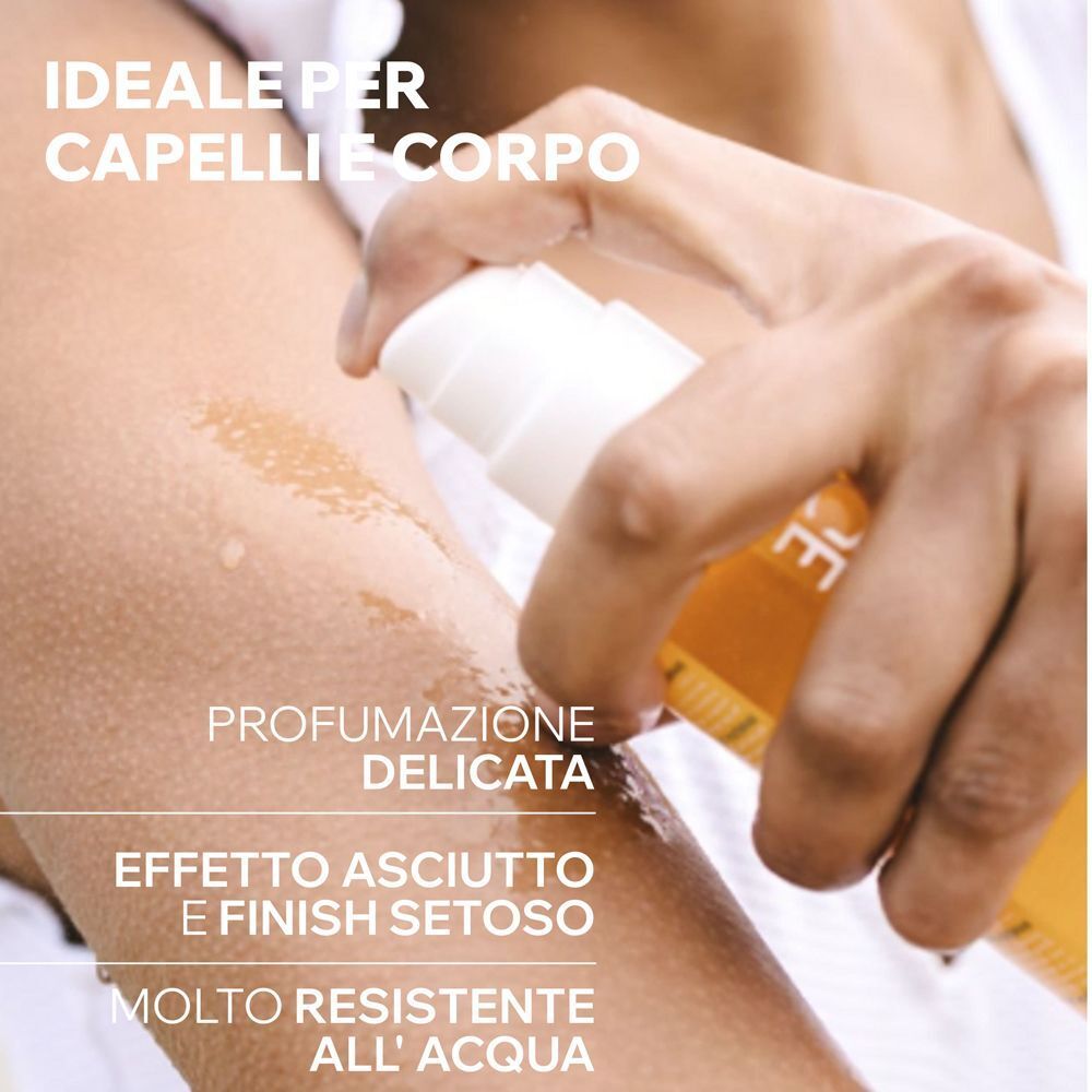 Applicazione dell'olio secco URIAGE Bariésun su pelle e capelli.