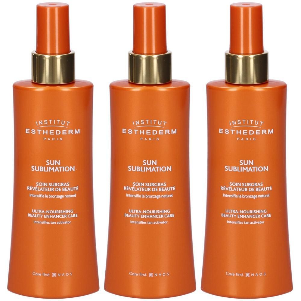 Tre flaconi spray arancioni con collare dorato e scritta bianca.