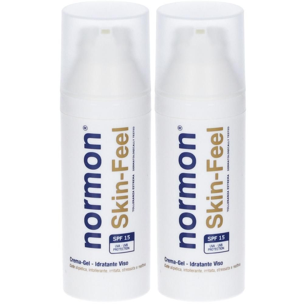 Due flaconi pump bianchi di Normon Skin-Feel Crema Gel, SPF 15.