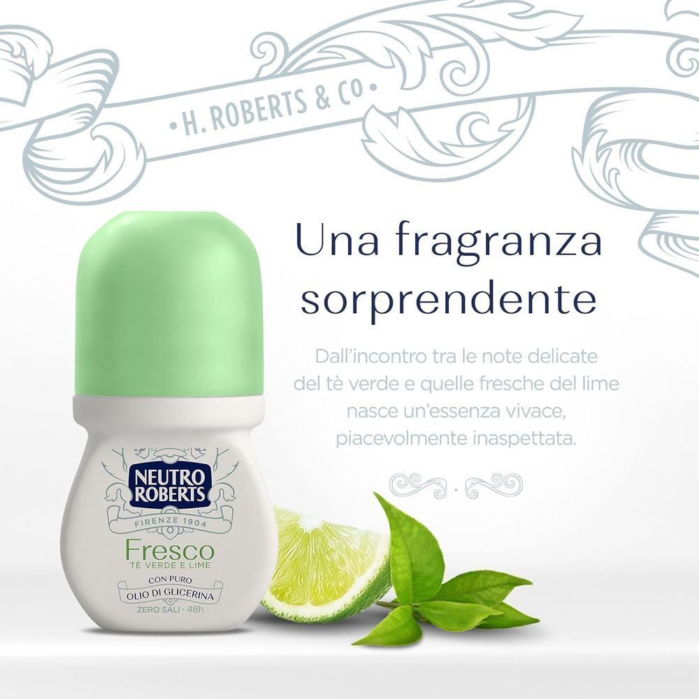 Deodorante roll-on con tappo verde ed etichetta "Neutro Roberts Fresco". Accanto ci sono spicchi di lime e foglie.