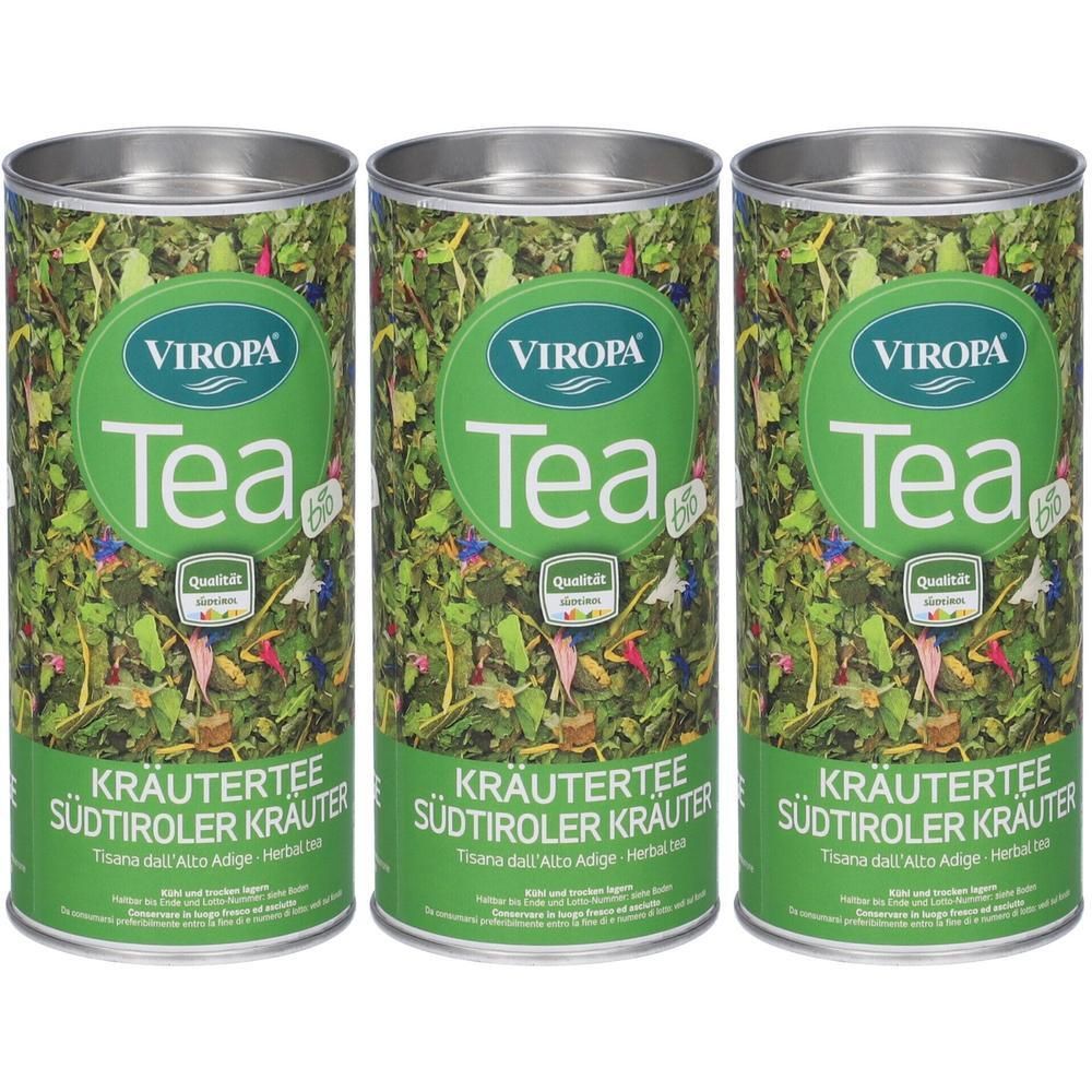 Tre lattine di tisana Viropa alle erbe dell'Alto Adige, decorate con erbe e fiori.