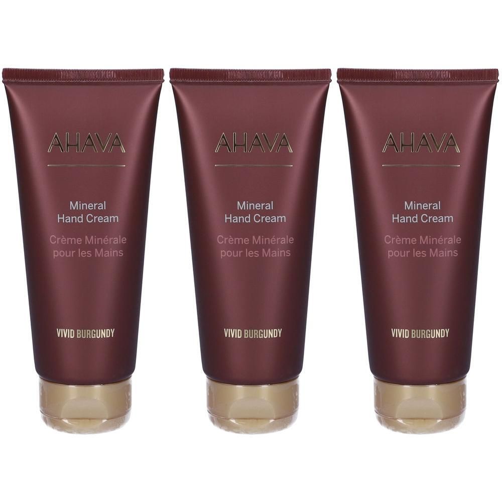 Tre tubi di Ahava Mineral Hand Cream in Vivid Burgundy con tappi dorati.