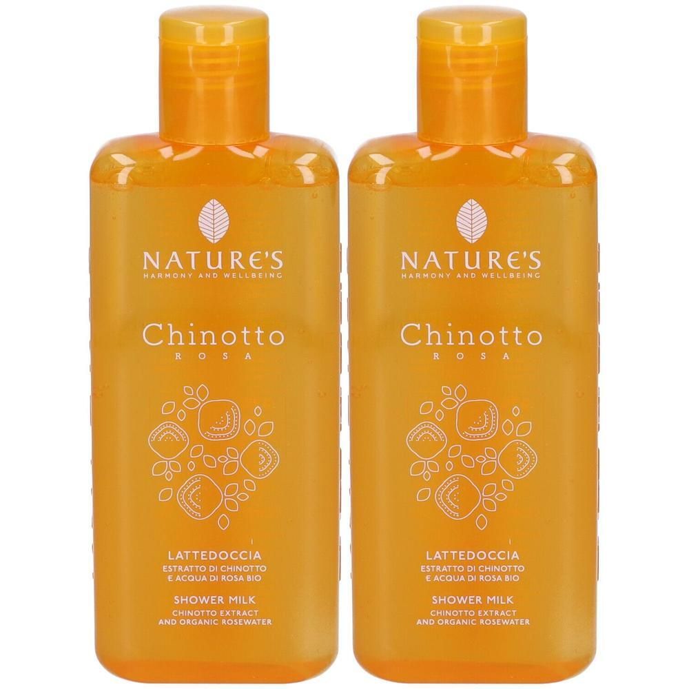 Due flaconi arancioni di Bagnoschiuma Chinotto Rosa Nature's con etichetta bianca e motivo floreale.