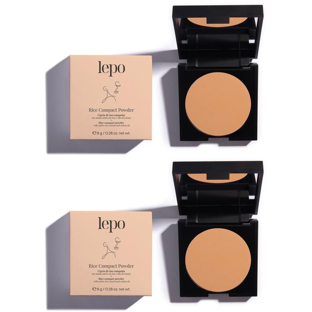 Due ciprie compatte Lepo Rice color beige, ciascuna in un astuccio nero con specchio e confezione in cartone.