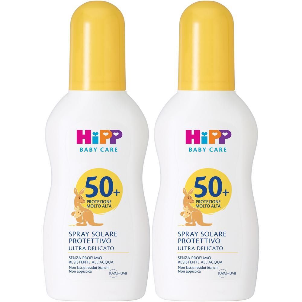 Due flaconi spray bianchi con tappi gialli, Hipp Baby Care protezione solare SPF 50+.