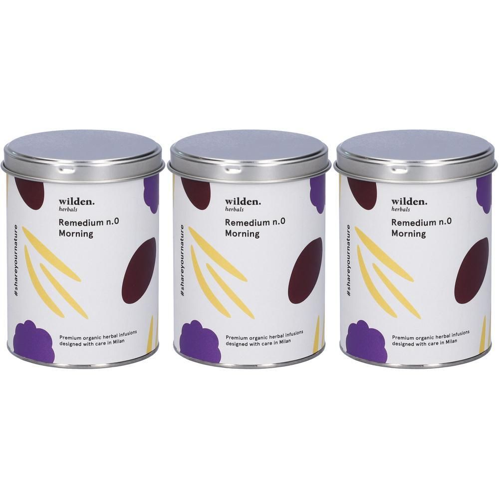 Tre lattine di tisana Wilden Remedium n.0 Morning con coperchi argentati ed elementi di design viola/gialli.