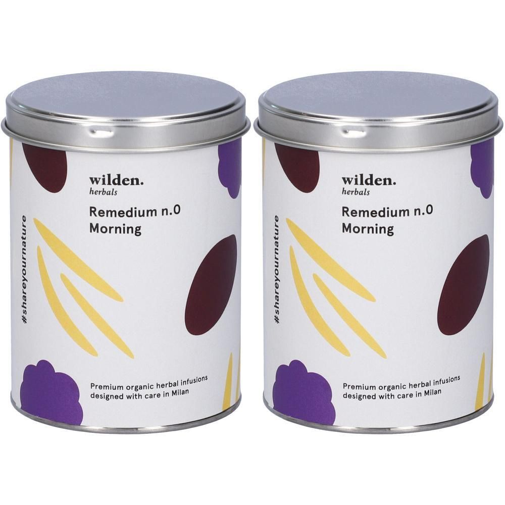 Due lattine Wilden Herbals Remedium n.0 Morning tisana. Lattine bianche con motivi viola e gialli.