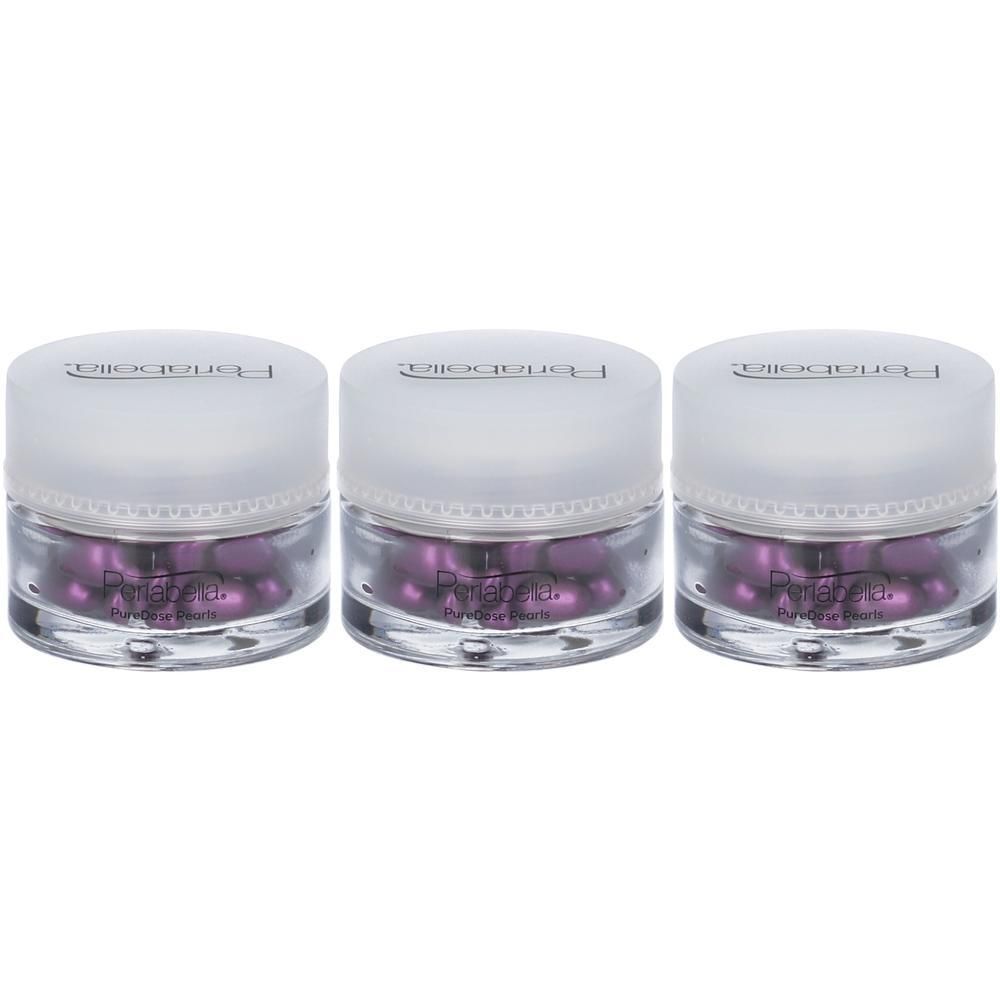Tre vasetti trasparenti con tappo bianco, contenenti capsule viola. Marchio 'Perlabella' visibile.