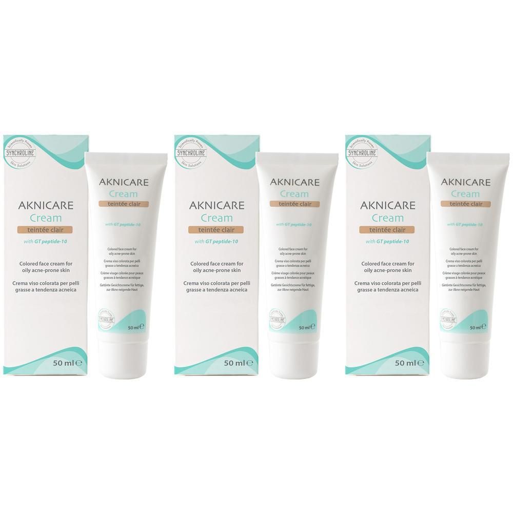 Aknicare Cream Teintee Clair: Tre tubetti e scatole di crema colorata per pelli grasse a tendenza acneica.