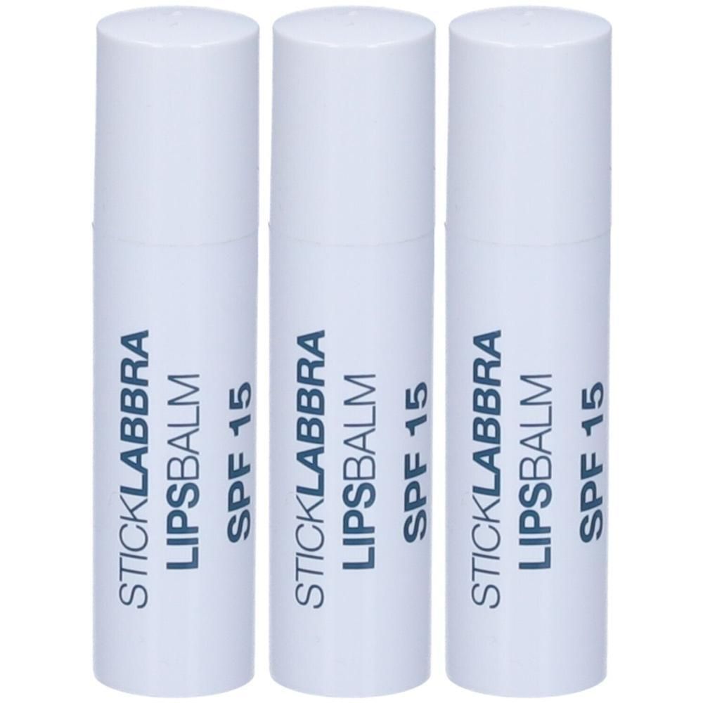 Tre stick labbra bianchi con scritta SPF 15.