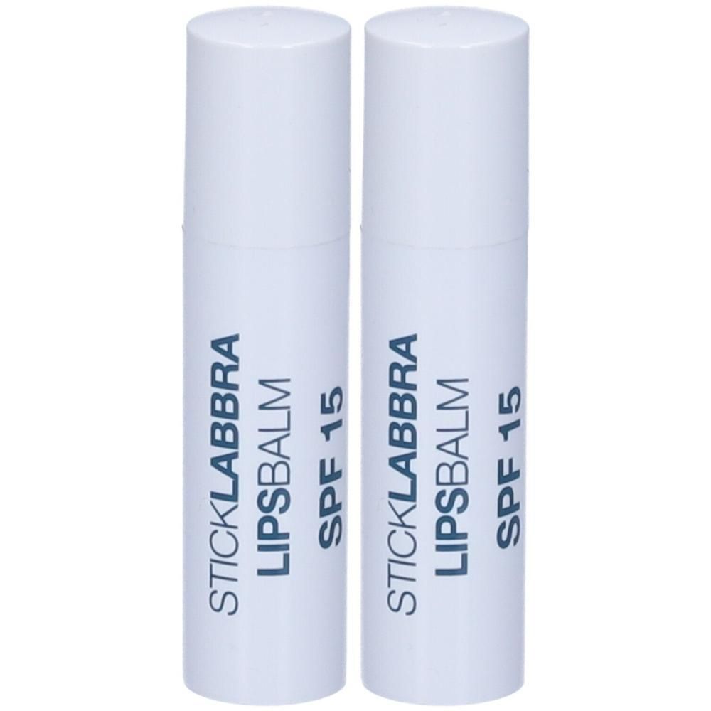 Due stick labbra bianchi con scritta "STICKLABBRA LIPSBALM SPF 15".