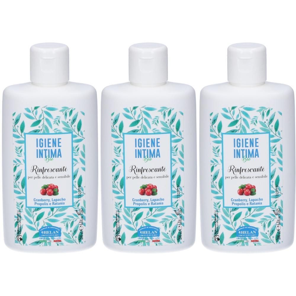 Tre flaconi di Igiene Intima Rinfrescante con decoro di foglie e immagine di bacche.