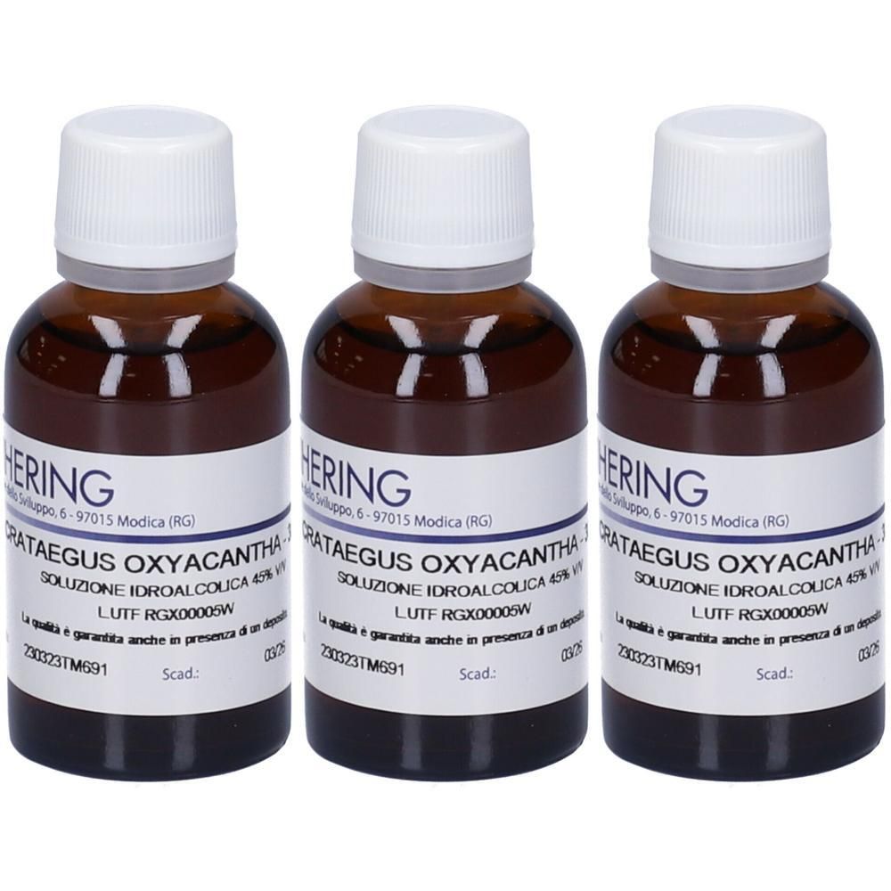 Tre flaconi in vetro ambrato con tappi bianchi, contenenti un liquido. Le etichette riportano 'HERING' e 'CRATAEGUS OXYACANTHA'.