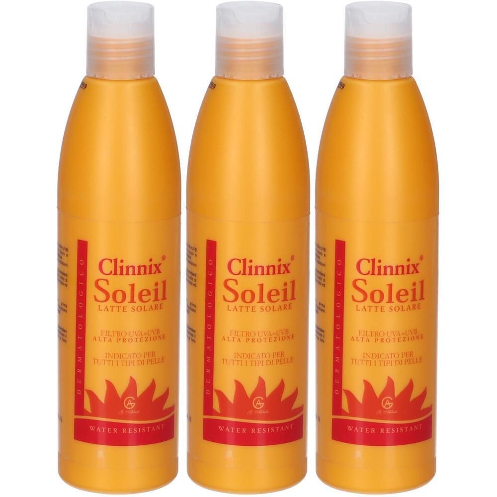 Tre flaconi arancioni Clinnix Soleil Latte Solare con tappo bianco. Resistente all'acqua.