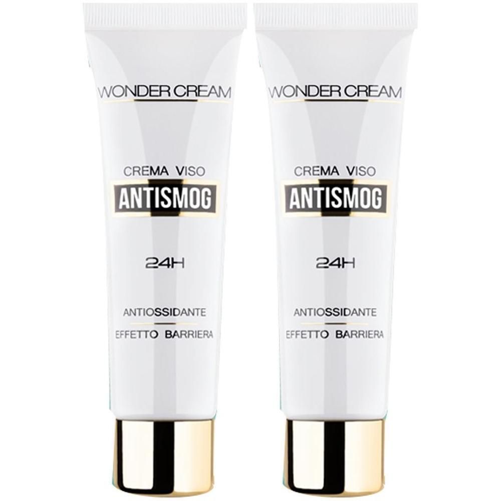 Due tubi bianchi di Wonder Cream Antismog Crema Viso, tappo dorato. 24H, antiossidante, effetto barriera.