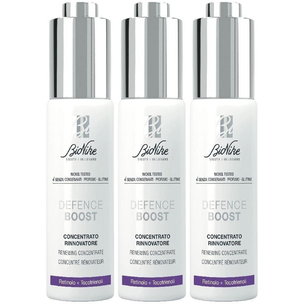 Tre flaconi BioNike Defence Boost con tappo contagocce. Bianchi con accenti argentati.