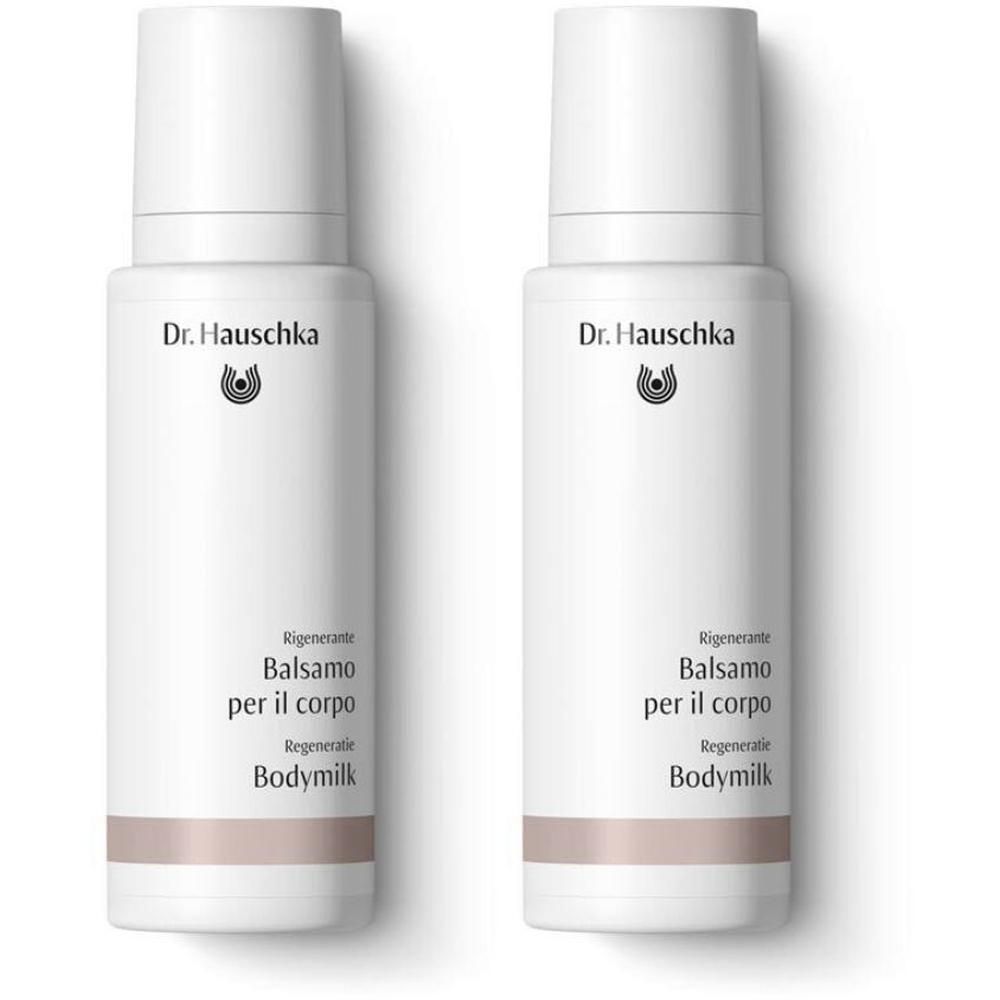 Due flaconi bianchi di Balsamo Rigenerante per il Corpo Dr. Hauschka con dispenser a pompa.