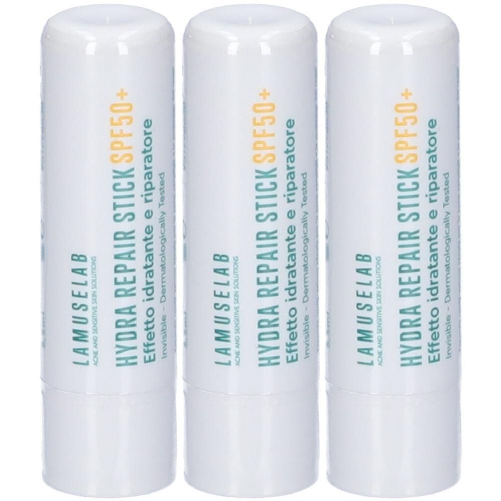 Tre Lamuselab Hydra Repair Stick con SPF 50+. Contenitore bianco con scritte verdi e arancioni.