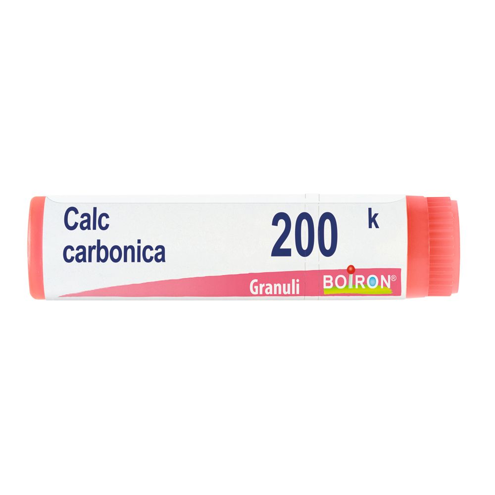 Confezione cilindrica "Calc carbonica 200 k Granuli" con logo BOIRON. Tappo ed estremità rosse.
