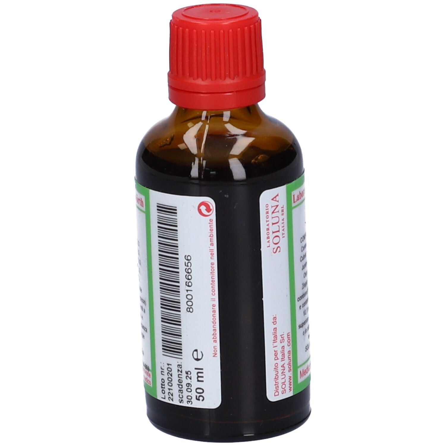 Flacone di vetro marrone con tappo rosso. Etichetta con nome del prodotto e ingredienti. Scritte verdi e bianche.