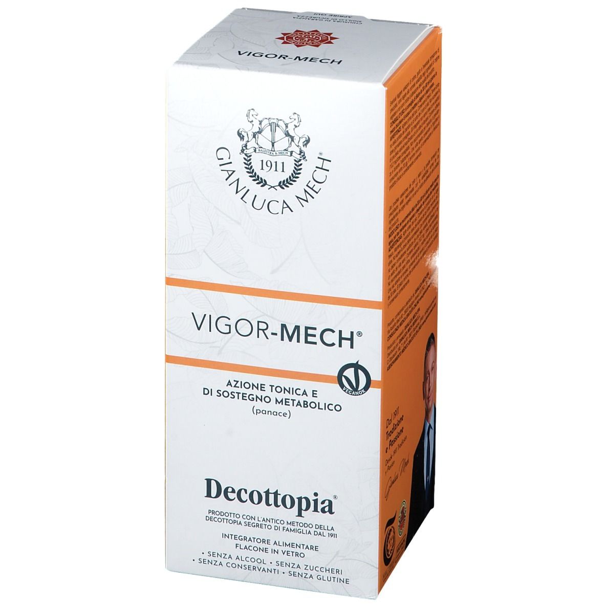 Confezione Vigor-Mech®. Scatola bianca e arancione con nome del prodotto, logo e testo. Contiene informazioni sugli ingredienti.