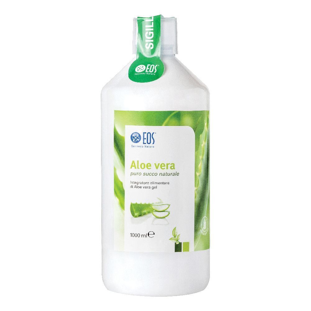Bottiglia bianca con etichetta verde. Scritta: Aloe vera, logo. Sigillo sul collo.