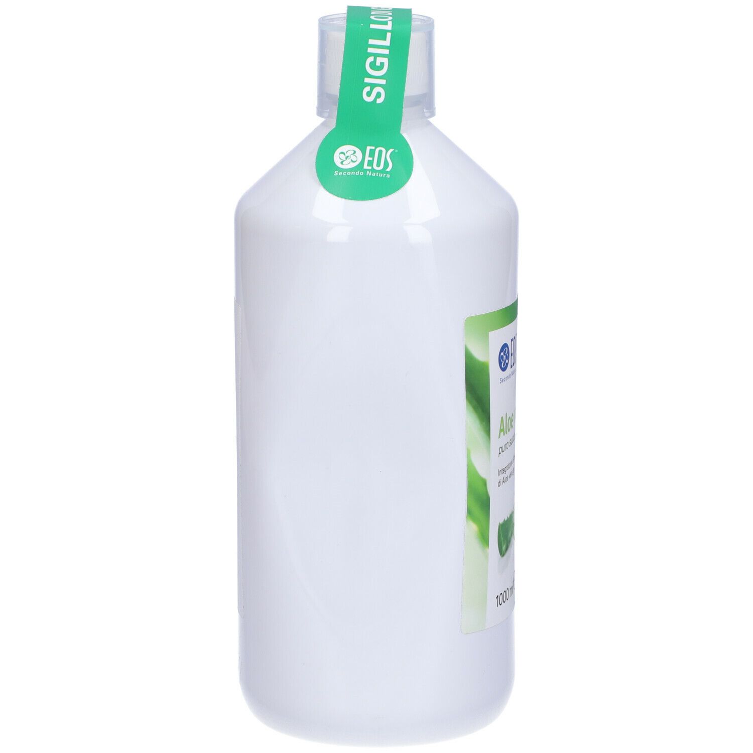 Bottiglia bianca con etichetta verde. Scritta: Aloe vera, logo. Sigillo sul collo.