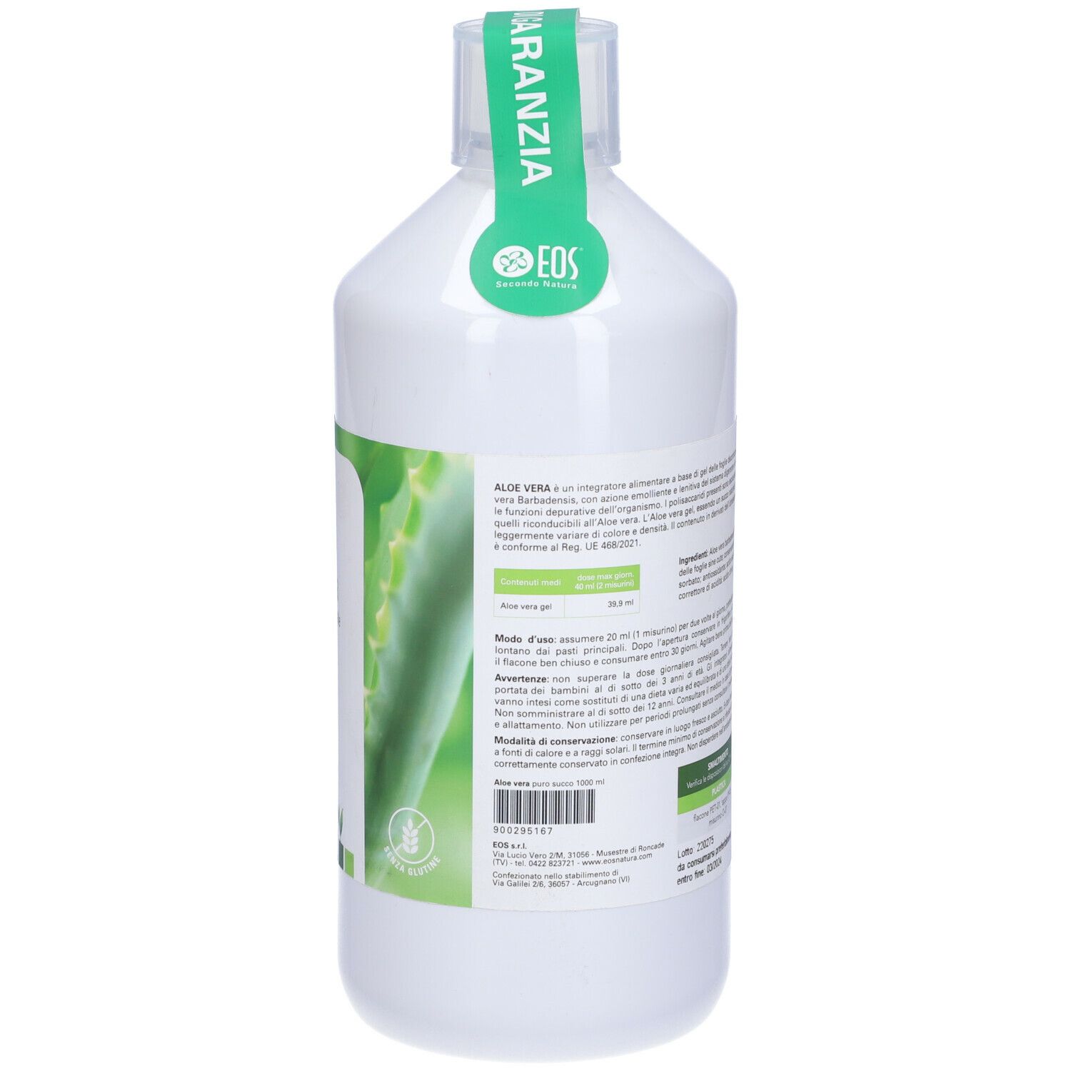 Bottiglia bianca con etichetta verde. Scritta: Aloe vera, logo. Sigillo sul collo.