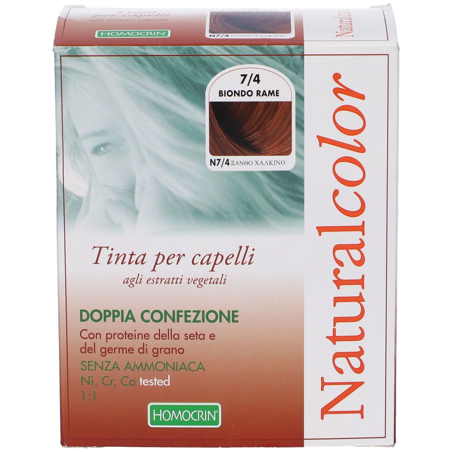 Scatola tinta per capelli Naturalcolor. Tonalità 7/4 Biondo Rame. Testo: Tinta per capelli. Logo Homocrin.